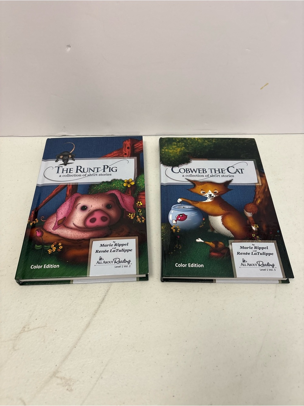 The Runt Pig & Cobweb Cat by Marie Rippel All About Reading Level 1 Vol. 2 & 3